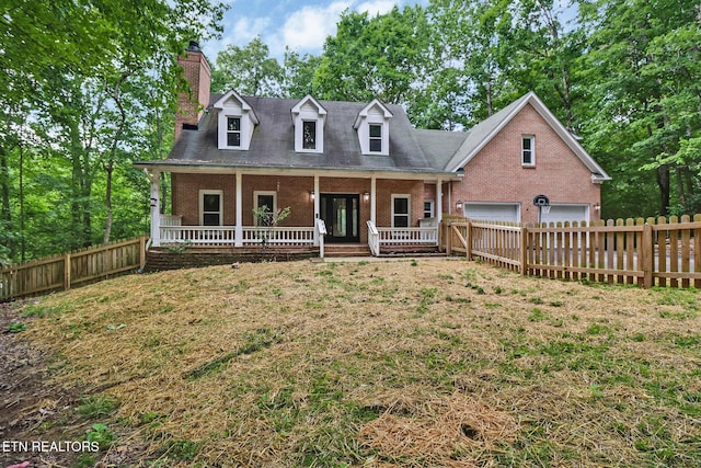 110 Lakecrest Ln, Oak Ridge, TN 37830 - new england style home with brick siding, a chimney, a garage, and a porch