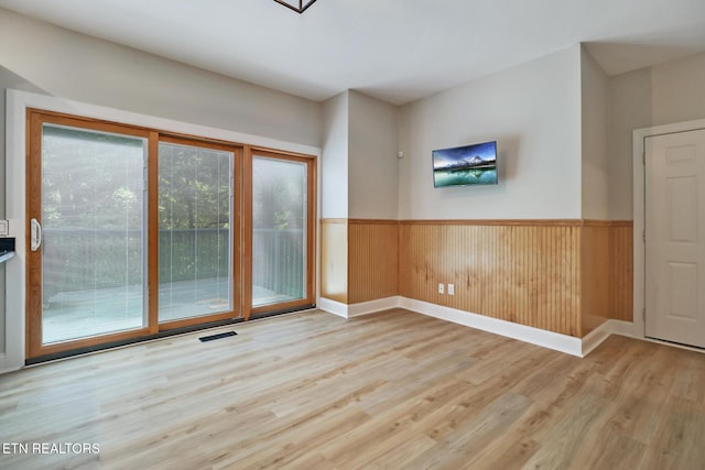 110 Lakecrest Ln, Oak Ridge, TN 37830 - unfurnished room with a wainscoted wall, wood finished floors, and wooden walls