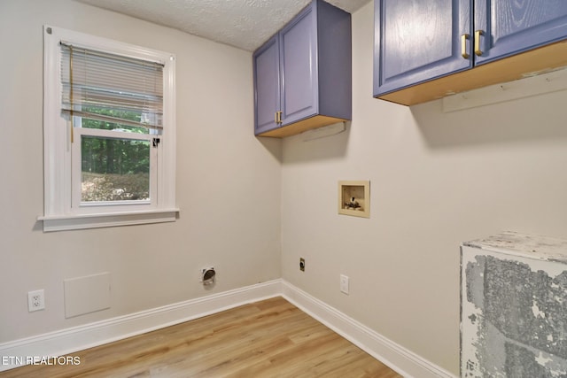 110 Lakecrest Ln, Oak Ridge, TN 37830 - laundry area with cabinet space, hookup for a washing machine, electric dryer hookup, light wood-type flooring, and a textured ceiling