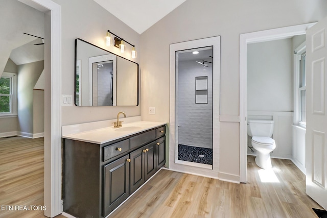 110 Lakecrest Ln, Oak Ridge, TN 37830 - full bathroom featuring vaulted ceiling, wood finished floors, vanity, and walk in shower