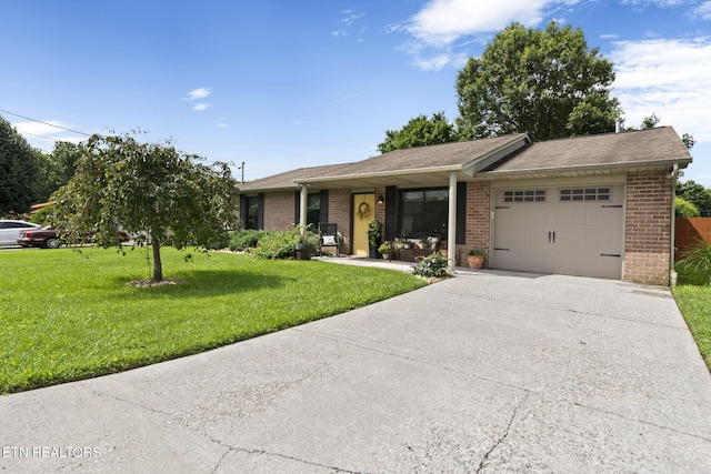 7217 Palermo Rd, Knoxville, TN 37918 - single story home with an attached garage, brick siding, driveway, a front yard, and a shingled roof