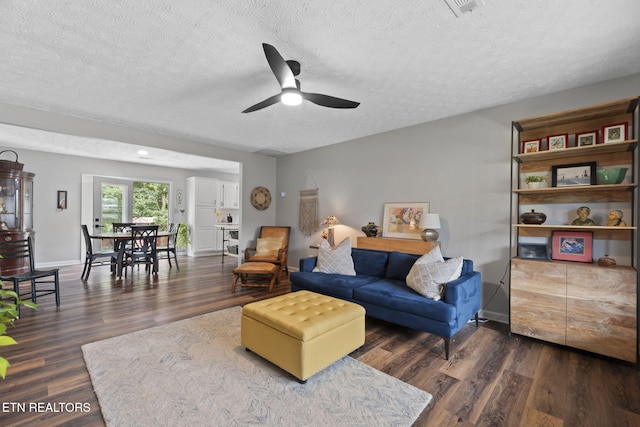 7217 Palermo Rd, Knoxville, TN 37918 - living room featuring a textured ceiling, a ceiling fan, and dark wood-type flooring