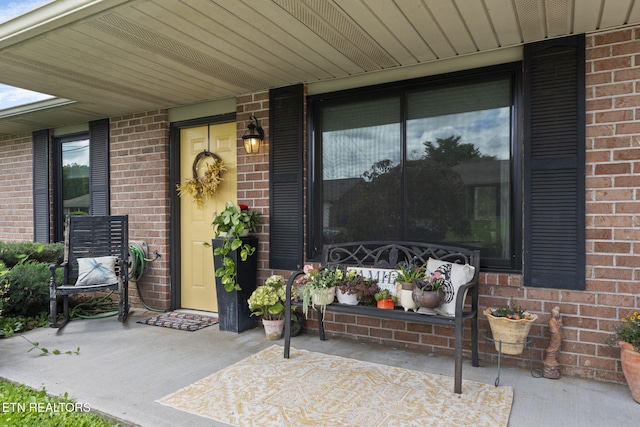 7217 Palermo Rd, Knoxville, TN 37918 - doorway to property with brick siding and a patio area