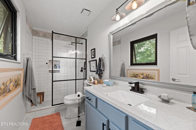 7217 Palermo Rd, Knoxville, TN 37918 - bathroom featuring vanity, tile patterned floors, a shower stall, and a textured ceiling