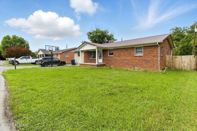 409 Meadow Ln, Middlesboro, KY 40965 - view of front of house with brick siding and a metal roof
