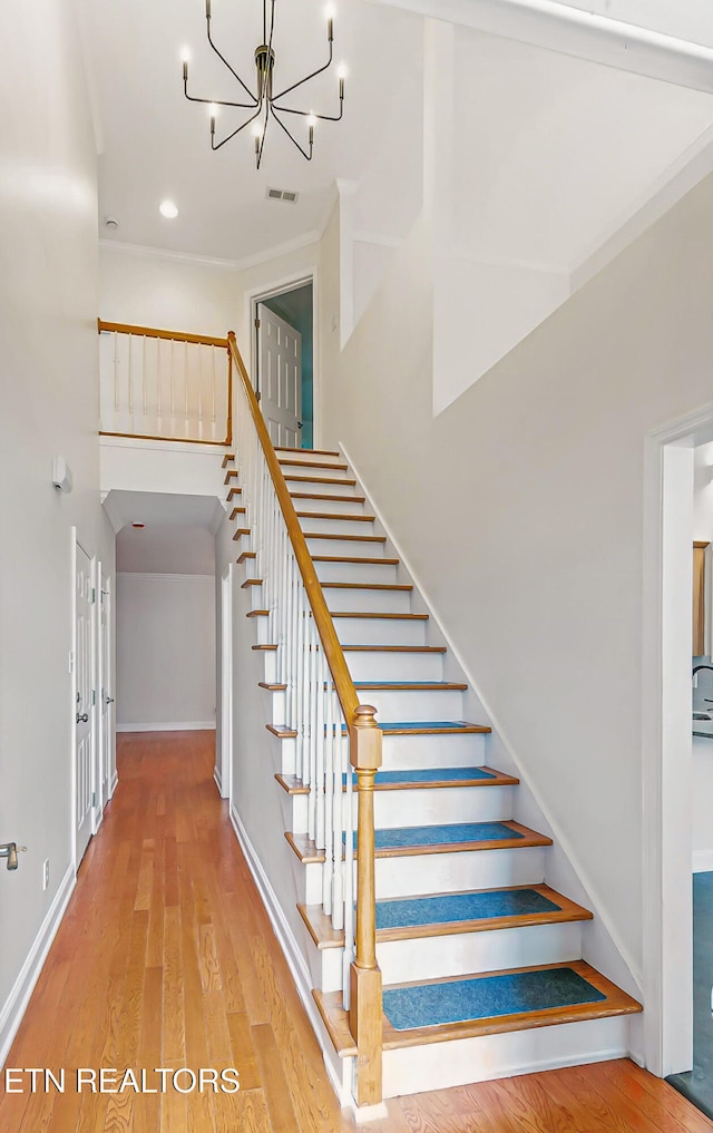 933 Gothic Manor Way, Knoxville, TN 37923 - staircase with wood finished floors, a towering ceiling, a chandelier, and recessed lighting