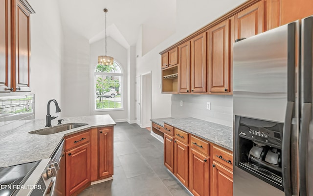 933 Gothic Manor Way, Knoxville, TN 37923 - kitchen featuring stainless steel refrigerator with ice dispenser, lofted ceiling, hanging light fixtures, a chandelier, and brown cabinets