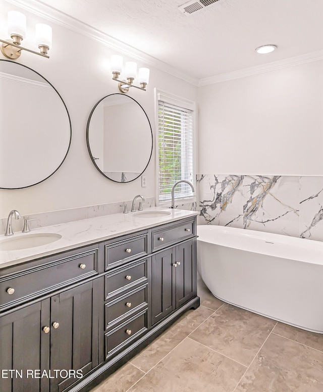 933 Gothic Manor Way, Knoxville, TN 37923 - bathroom featuring ornamental molding, double vanity, and a freestanding bath