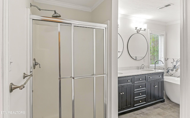 933 Gothic Manor Way, Knoxville, TN 37923 - full bath featuring double vanity, a shower stall, ornamental molding, a soaking tub, and tile patterned flooring