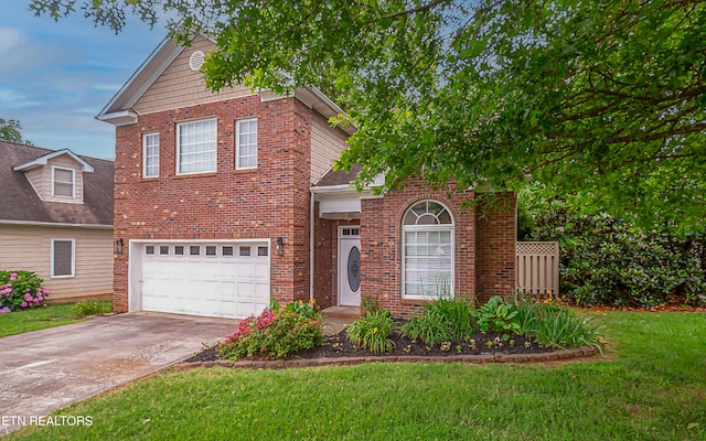 933 Gothic Manor Way, Knoxville, TN 37923 - traditional-style house with driveway, a garage, a front yard, and brick siding