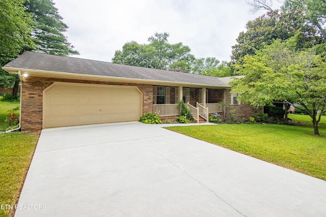 1705 Bobwhite Dr, Maryville, TN 37803 - ranch-style home featuring brick siding, a garage, concrete driveway, a front yard, and covered porch