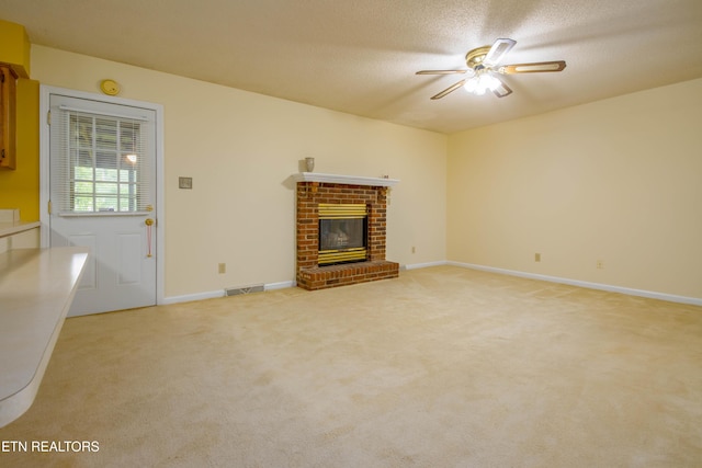 1705 Bobwhite Dr, Maryville, TN 37803 - unfurnished living room featuring a ceiling fan, a fireplace, and light carpet