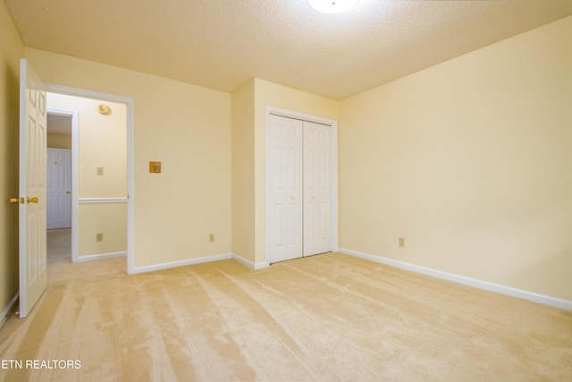 1705 Bobwhite Dr, Maryville, TN 37803 - unfurnished bedroom with light carpet, a closet, and a textured ceiling
