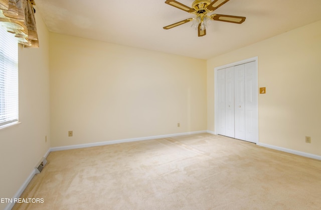 1705 Bobwhite Dr, Maryville, TN 37803 - unfurnished bedroom with light carpet, a closet, and a ceiling fan