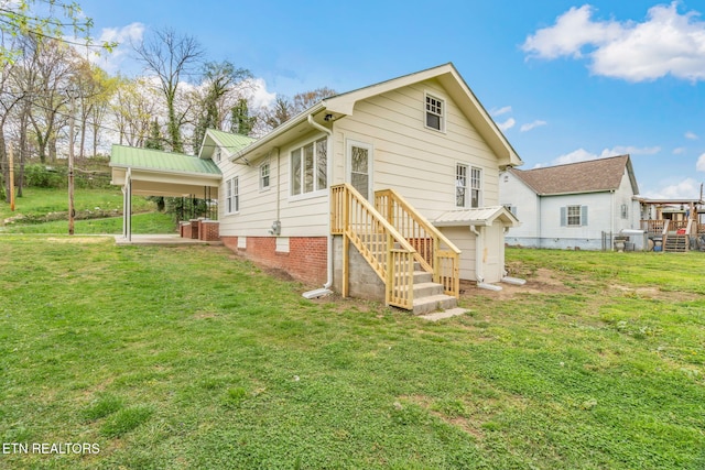 406 S Indiana Ave, Lafollette, TN 37766 - rear view of property featuring a lawn
