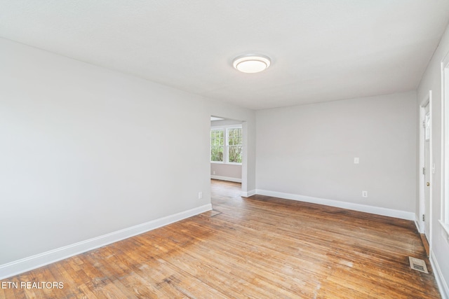 406 S Indiana Ave, Lafollette, TN 37766 - spare room featuring baseboards and light wood finished floors