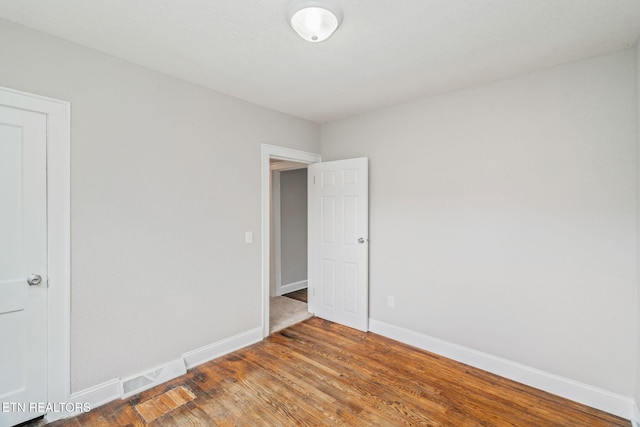 406 S Indiana Ave, Lafollette, TN 37766 - spare room featuring baseboards and wood finished floors