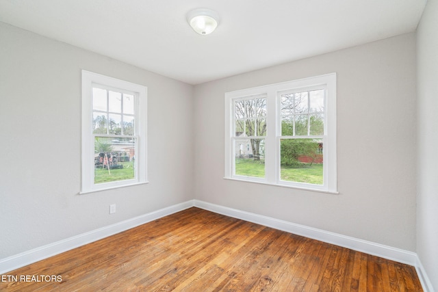 406 S Indiana Ave, Lafollette, TN 37766 - unfurnished room featuring plenty of natural light and hardwood / wood-style floors