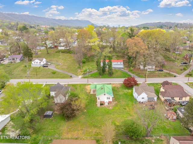 406 S Indiana Ave, Lafollette, TN 37766 - aerial view of property's location featuring nearby suburban area and a mountainous background