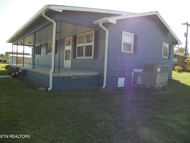 23 Mitchell St, Spencer, TN 38585 - view of property exterior with a lawn and covered porch