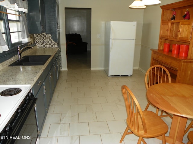 23 Mitchell St, Spencer, TN 38585 - kitchen with white appliances and decorative backsplash