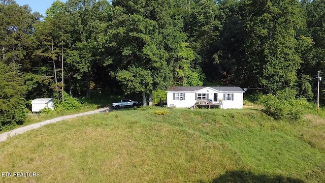 167 Marina Ln, Lafollette, TN 37766 - view of yard with an outdoor structure and a forest view