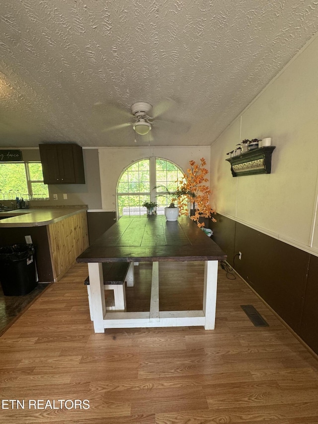 167 Marina Ln, Lafollette, TN 37766 - unfurnished dining area with a ceiling fan, wood finished floors, and a textured ceiling