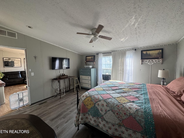 167 Marina Ln, Lafollette, TN 37766 - bedroom featuring vaulted ceiling, wood finished floors, a textured ceiling, ornamental molding, and ceiling fan