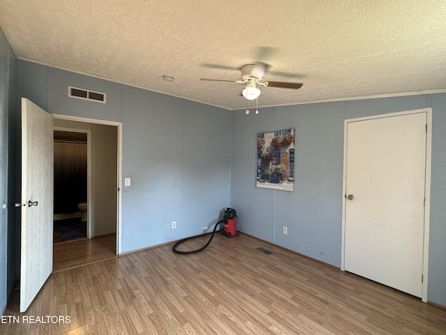 167 Marina Ln, Lafollette, TN 37766 - spare room with ceiling fan, a textured ceiling, and wood finished floors