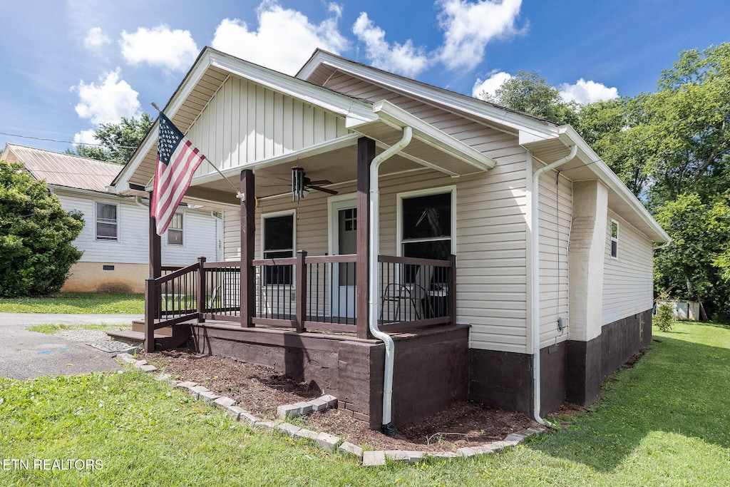 615 S Everett High Rd, Maryville, TN 37804 - view of front facade with a porch, ceiling fan, a front yard, and board and batten siding