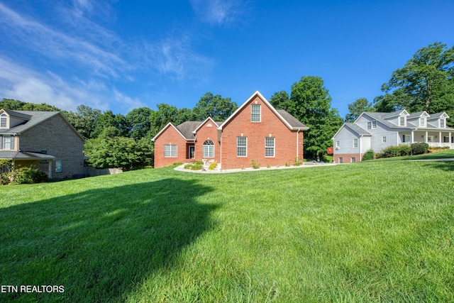 2150 Hirst Cir, Lenoir City, TN 37771 - traditional-style house featuring a front yard and brick siding