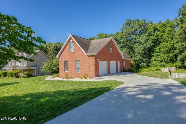 2150 Hirst Cir, Lenoir City, TN 37771 - view of side of home featuring brick siding, driveway, a lawn, and roof with shingles