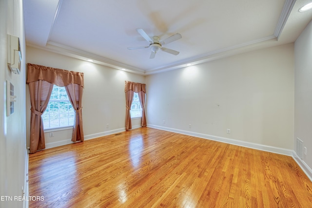 2150 Hirst Cir, Lenoir City, TN 37771 - spare room featuring light wood-style flooring, a ceiling fan, and ornamental molding