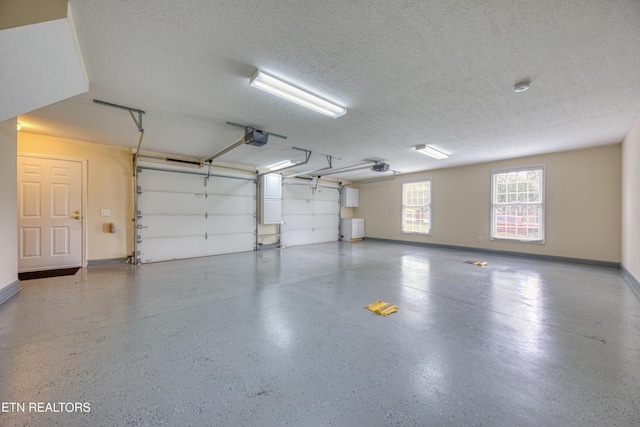 2150 Hirst Cir, Lenoir City, TN 37771 - garage featuring a garage door opener