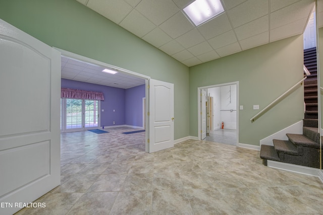 2150 Hirst Cir, Lenoir City, TN 37771 - spare room with a paneled ceiling and stairs
