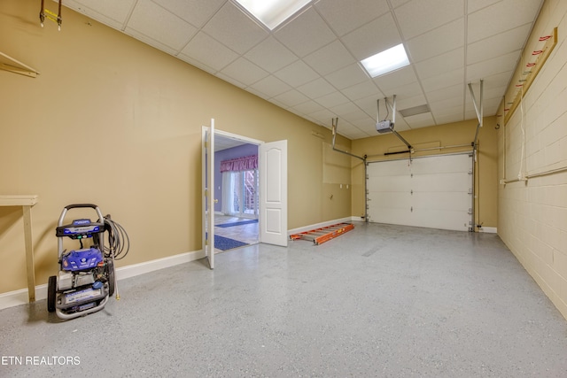 2150 Hirst Cir, Lenoir City, TN 37771 - garage featuring a garage door opener and baseboards