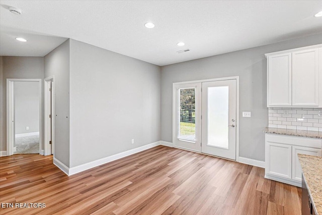 8630 Yellow Aster Rd, Knoxville, TN 37931 - unfurnished dining area featuring light wood finished floors and recessed lighting