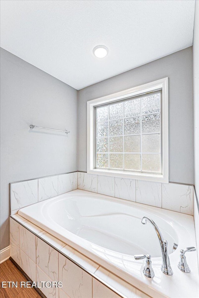 8630 Yellow Aster Rd, Knoxville, TN 37931 - full bath with a bath and wood finished floors