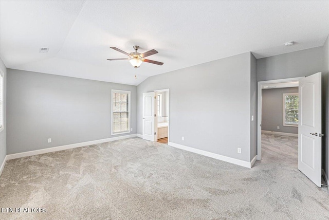 8630 Yellow Aster Rd, Knoxville, TN 37931 - unfurnished bedroom with carpet floors, lofted ceiling, ensuite bath, and a ceiling fan