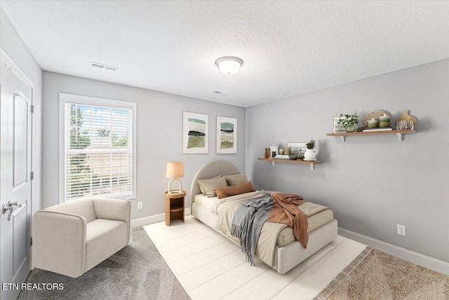 8630 Yellow Aster Rd, Knoxville, TN 37931 - bedroom with a textured ceiling and light colored carpet