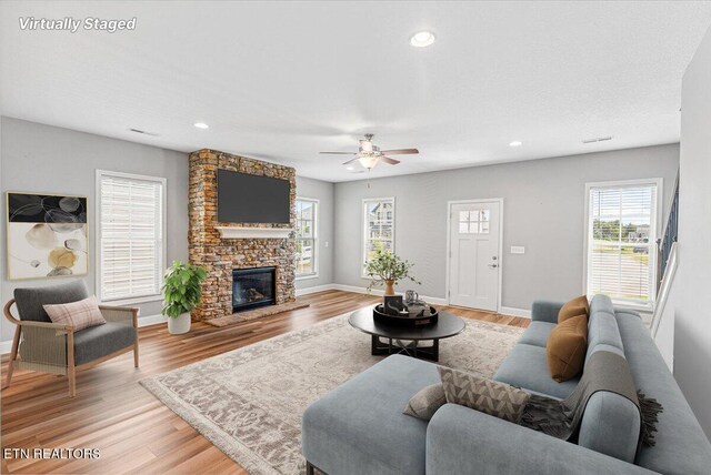 8630 Yellow Aster Rd, Knoxville, TN 37931 - living room with a ceiling fan, light wood-style flooring, a fireplace, and recessed lighting