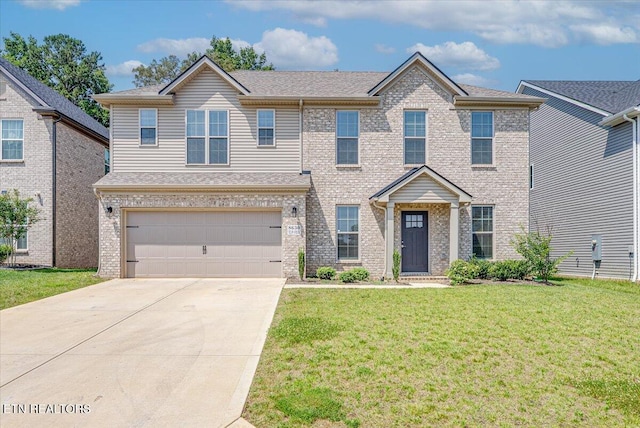 8630 Yellow Aster Rd, Knoxville, TN 37931 - view of front of house featuring concrete driveway, a front yard, brick siding, and a garage