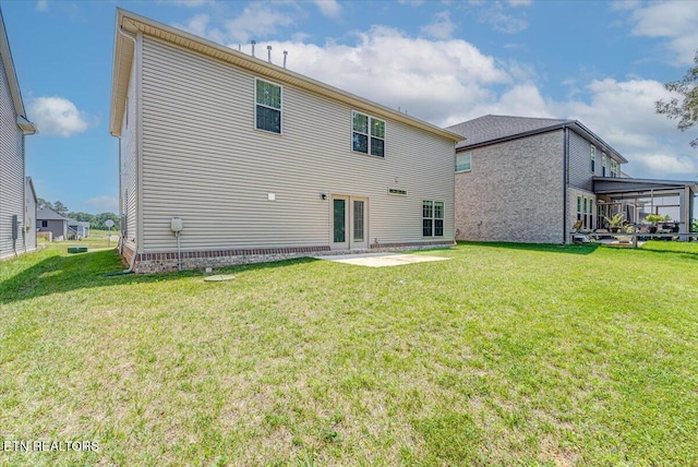 8630 Yellow Aster Rd, Knoxville, TN 37931 - back of property featuring a lawn and french doors