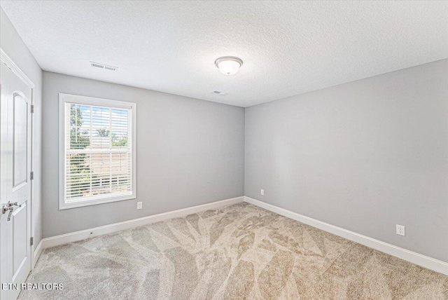 8630 Yellow Aster Rd, Knoxville, TN 37931 - unfurnished room with carpet floors and a textured ceiling