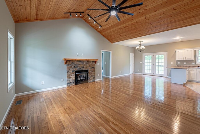 200 W Park Cir, Decatur, TN 37322 - unfurnished living room featuring wooden ceiling, rail lighting, a chandelier, a ceiling fan, and light wood finished floors