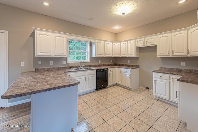 200 W Park Cir, Decatur, TN 37322 - kitchen featuring black dishwasher, a peninsula, dark countertops, white cabinets, and light tile patterned floors