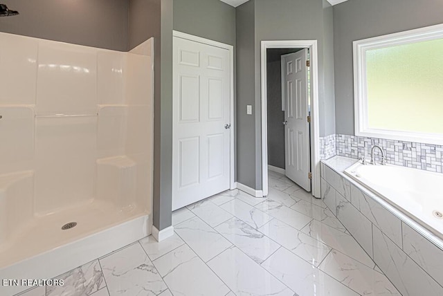 200 W Park Cir, Decatur, TN 37322 - bathroom with marble look tile flooring, a bath, and a shower