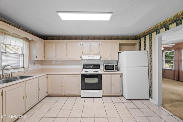 132 County Road 79, Riceville, TN 37370 - kitchen featuring freestanding refrigerator, electric range, stainless steel microwave, under cabinet range hood, and wallpapered walls
