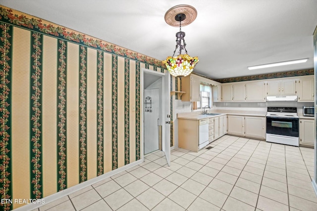 132 County Road 79, Riceville, TN 37370 - kitchen featuring electric range oven, under cabinet range hood, light countertops, light tile patterned flooring, and white dishwasher
