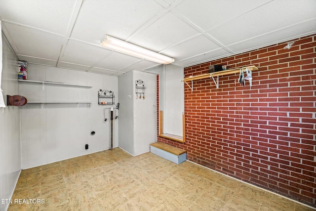 132 County Road 79, Riceville, TN 37370 - basement with brick wall and tile patterned floors